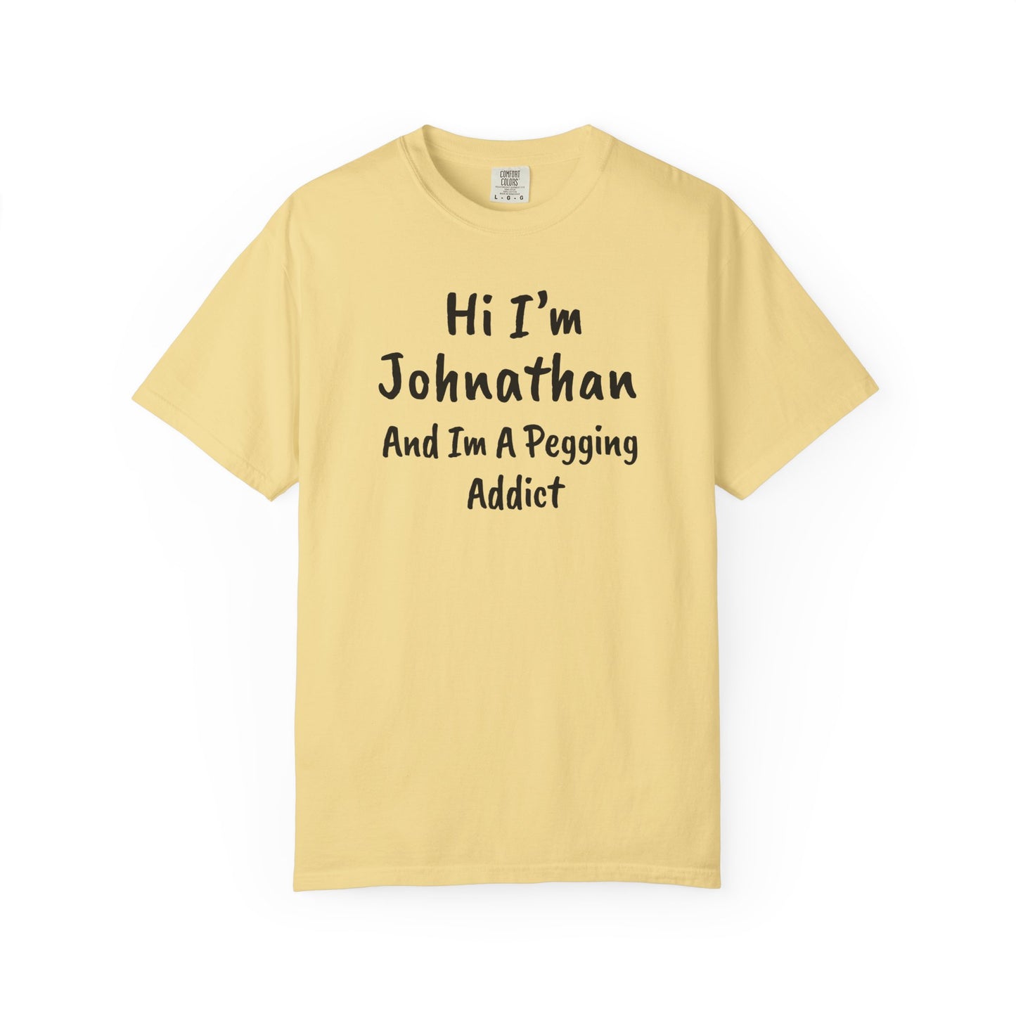 Butter garment-dyed heavyweight t-shirt with personalized 'Hi I'm [Name] And I'm A Pegging Addict' graphic in handwritten-style font, centered on chest