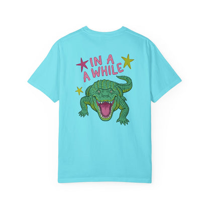 chalky mint t-shirts with alligator graphics on front "later gator" and the text on back i"n a while crocodile"a plain background