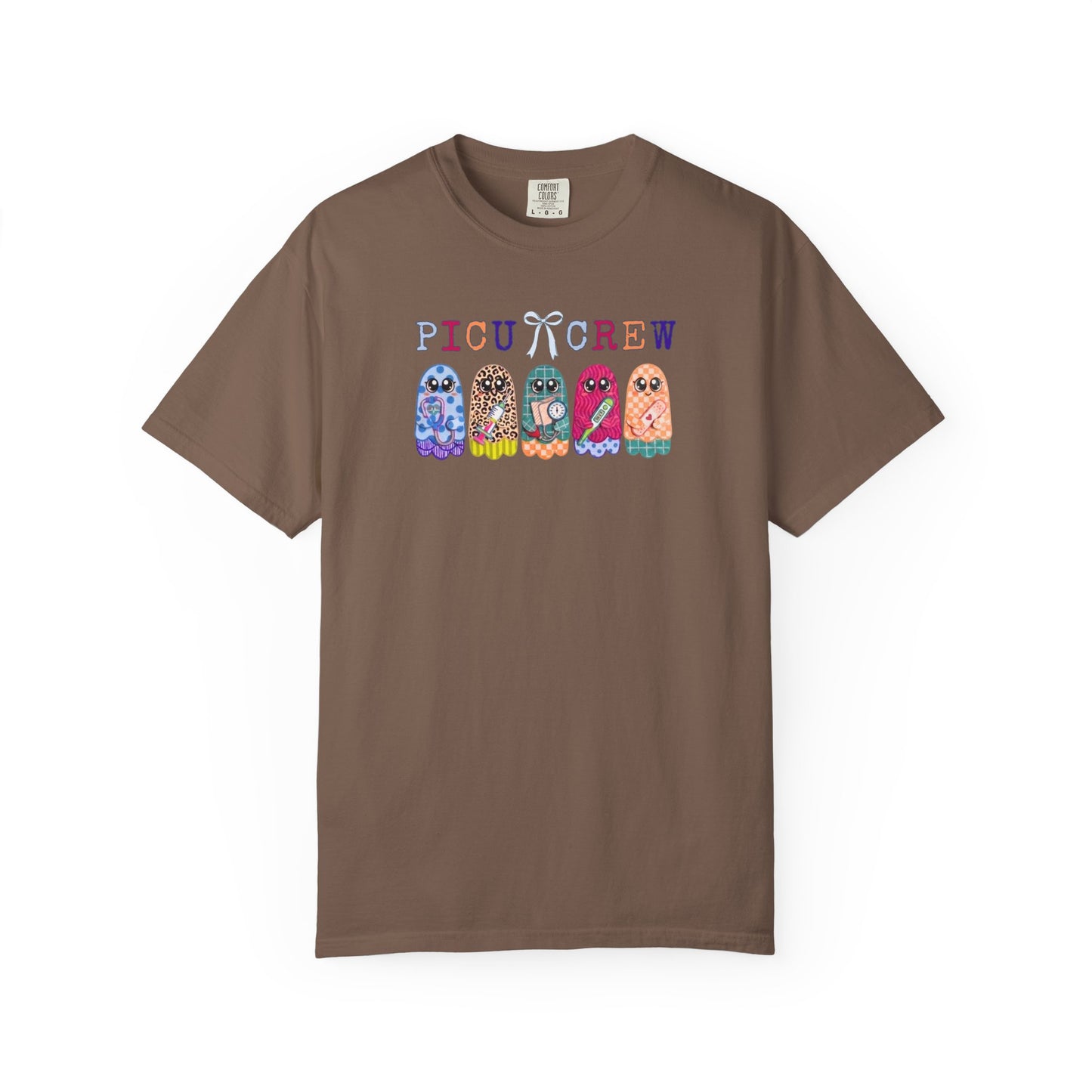 Espresso Comfort Colors PICU Crew t-shirt with five colorful patterned ghosts holding nursing tools — pediatric ICU nurse graphic tee, flat lay