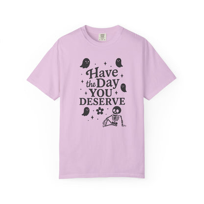 orchid  t-shirt with Halloween-themed design and text that says "have the day you deserve" on a white background