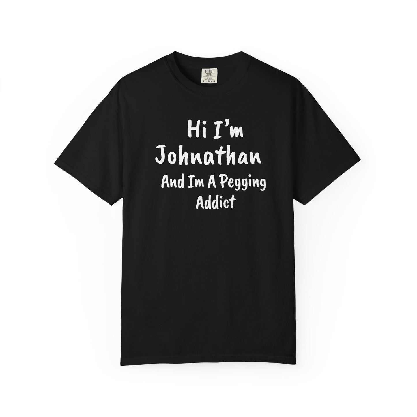 Black garment-dyed heavyweight t-shirt with personalized 'Hi I'm [Name] And I'm A Pegging Addict' graphic in handwritten-style font, centered on chest