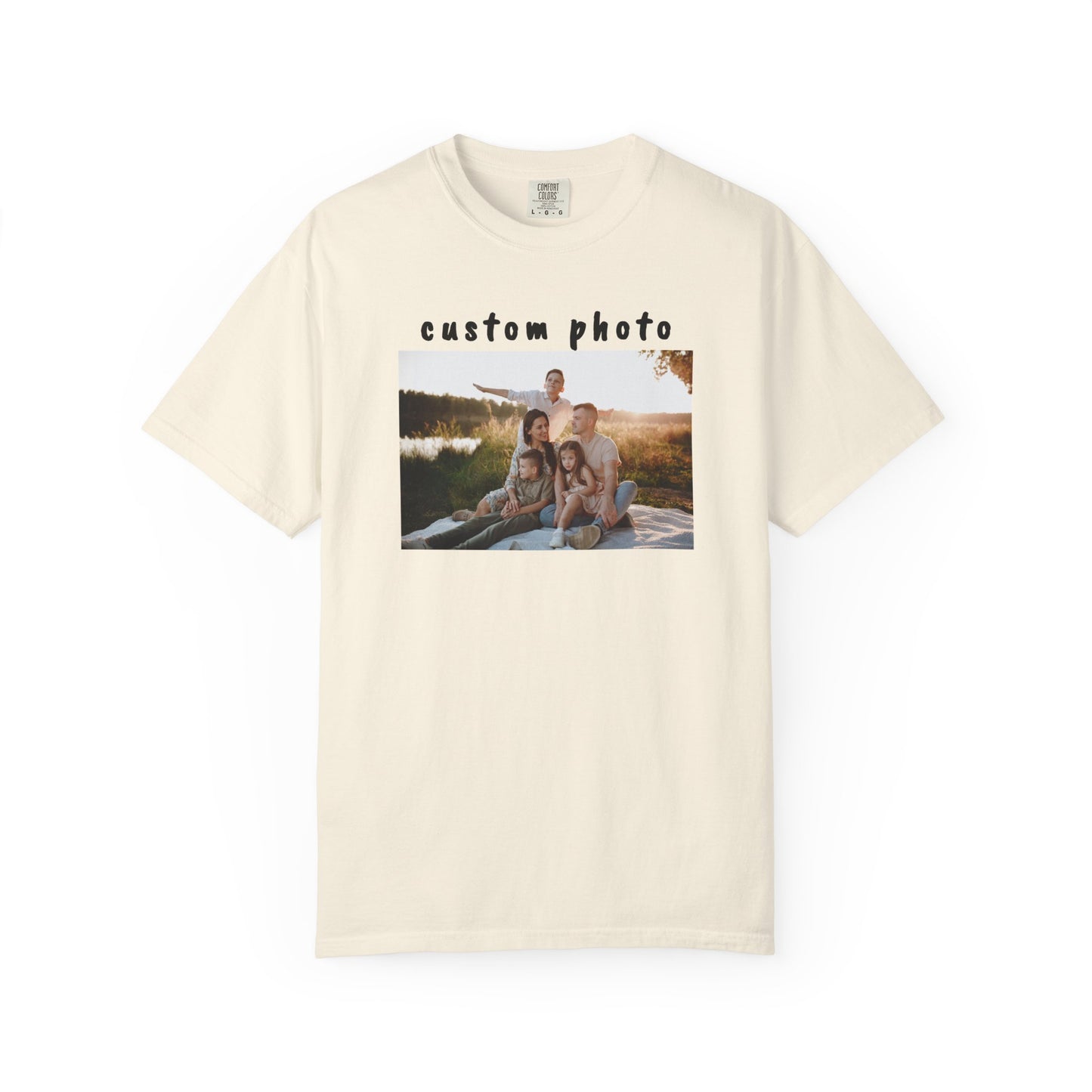 ivory t-shirt with a printed photo of a family on a grassy field.