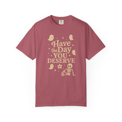 crimson  t-shirt with Halloween-themed design and text that says "have the day you deserve" on a white background