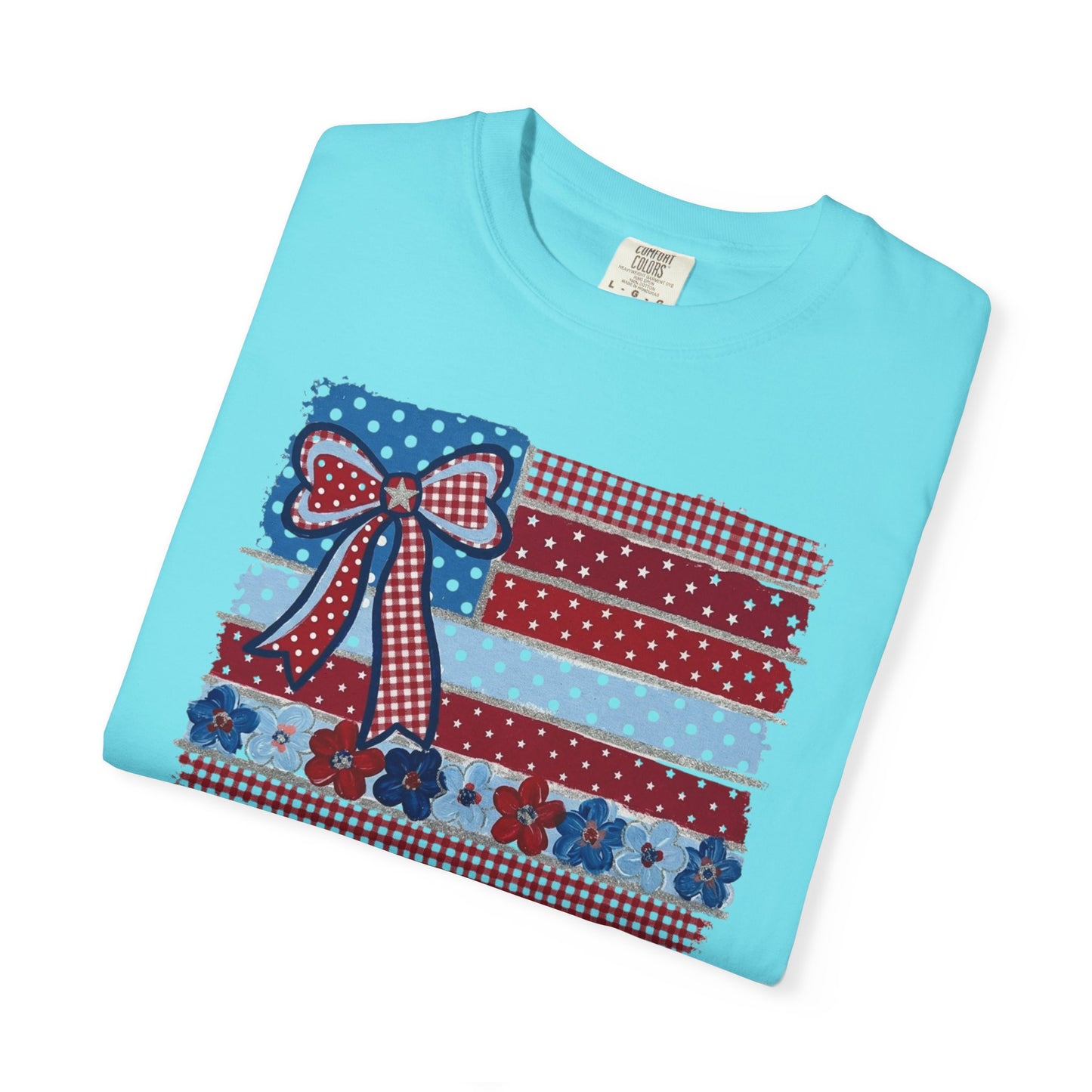Lagoon Blue garment-dyed t-shirt with Americana patchwork flag bow graphic in red, white and blue