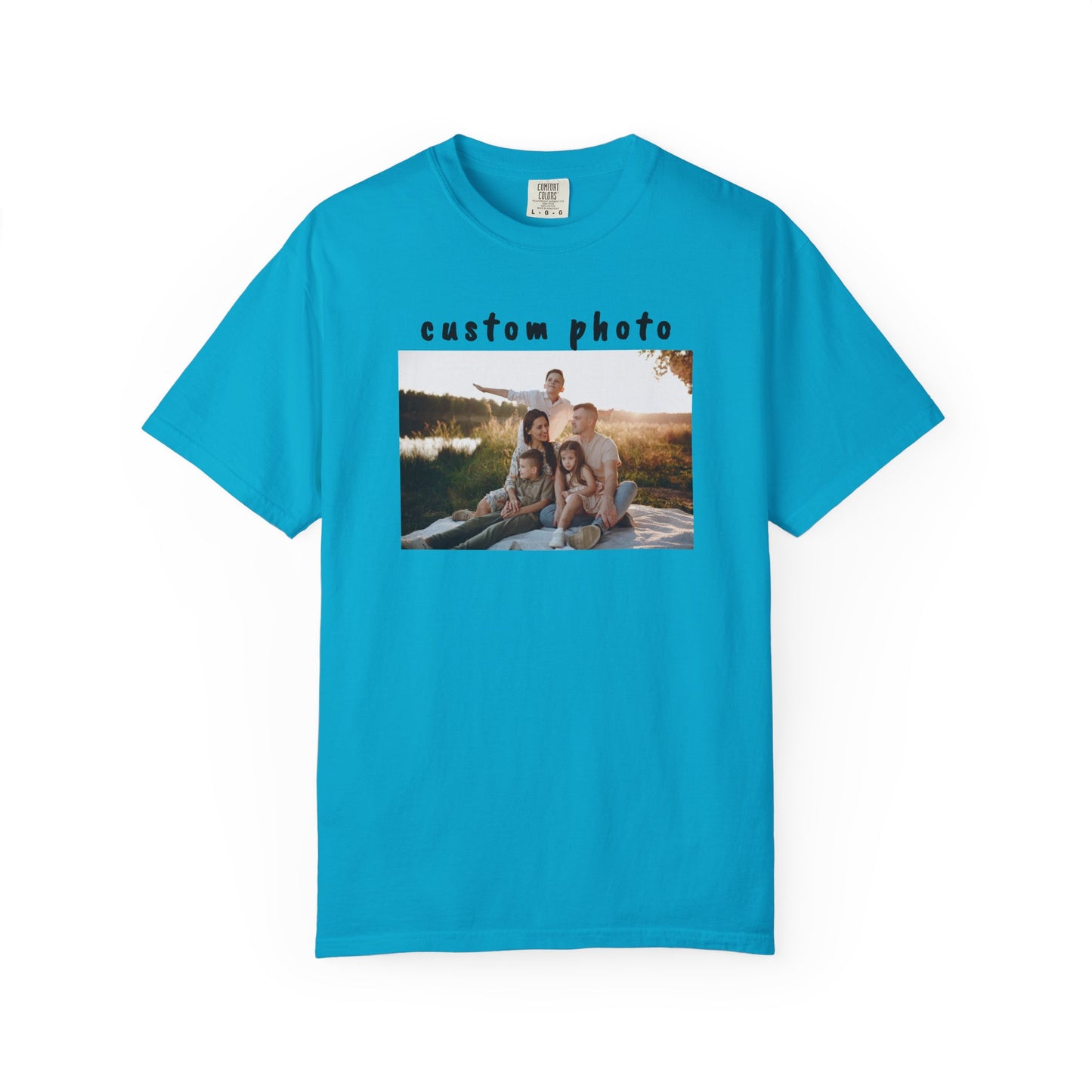 Lagoon Blue t-shirt with a printed photo of a family by a lake on a white background