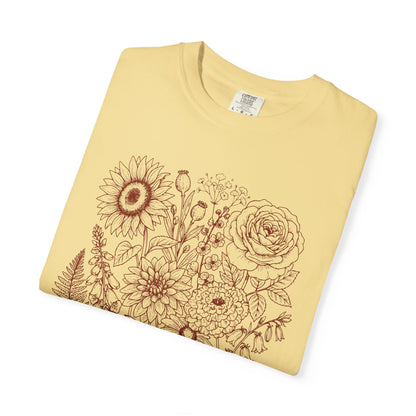 Comfort Colors® Butter shirt with hand-drawn botanical line art print featuring sunflower, rose, dahlia, and wildflowers