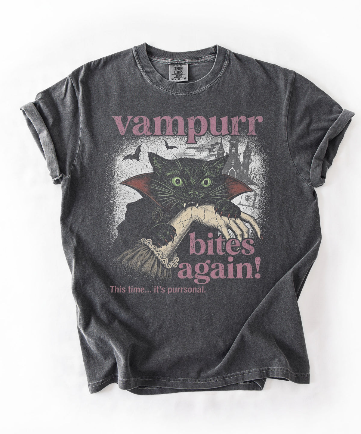 Funny Halloween cat shirt featuring a black cat in a vampire cape, bats, and the text “Vampurr Bites Again! in Pepper color 