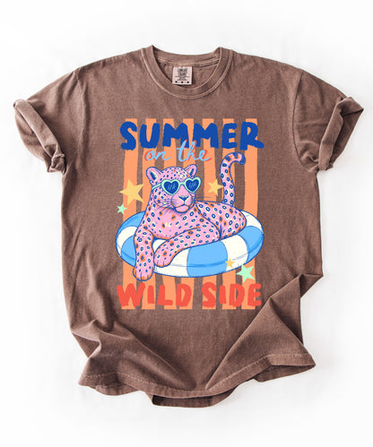 espresso colored  t-shirt with a graphic of a leopard on an inflatable ring and 'Summer on the Wild Side' text.