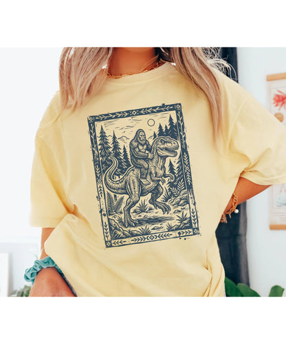 Bigfoot Riding T‑Rex Comfort Colors T‑Shirt